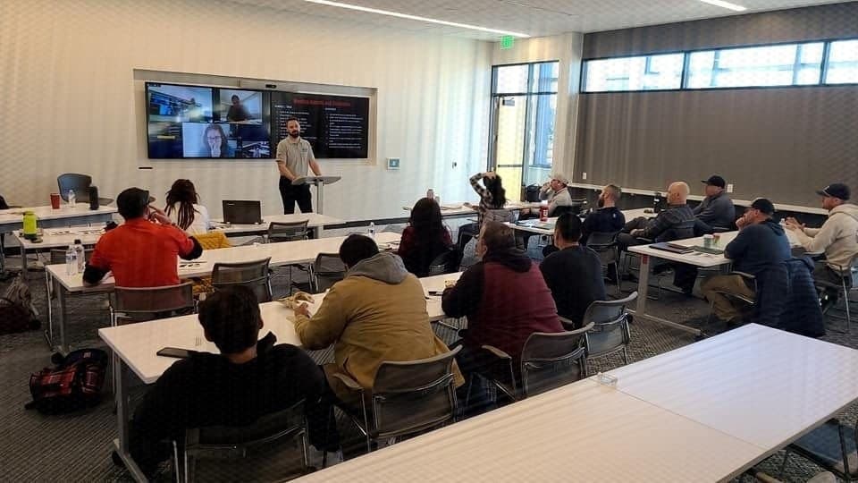 A Roofing Academy workshop session with roofing company owners